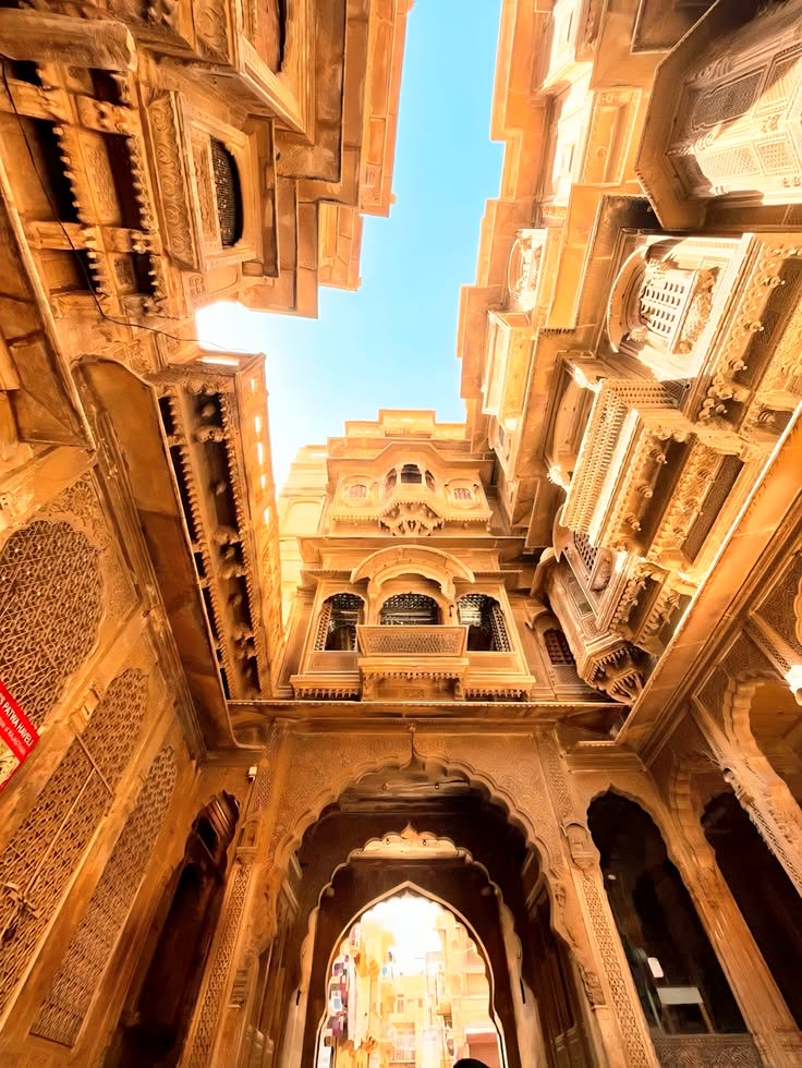 Intricately carved sandstone windows on a historic Jaisalmer haveli